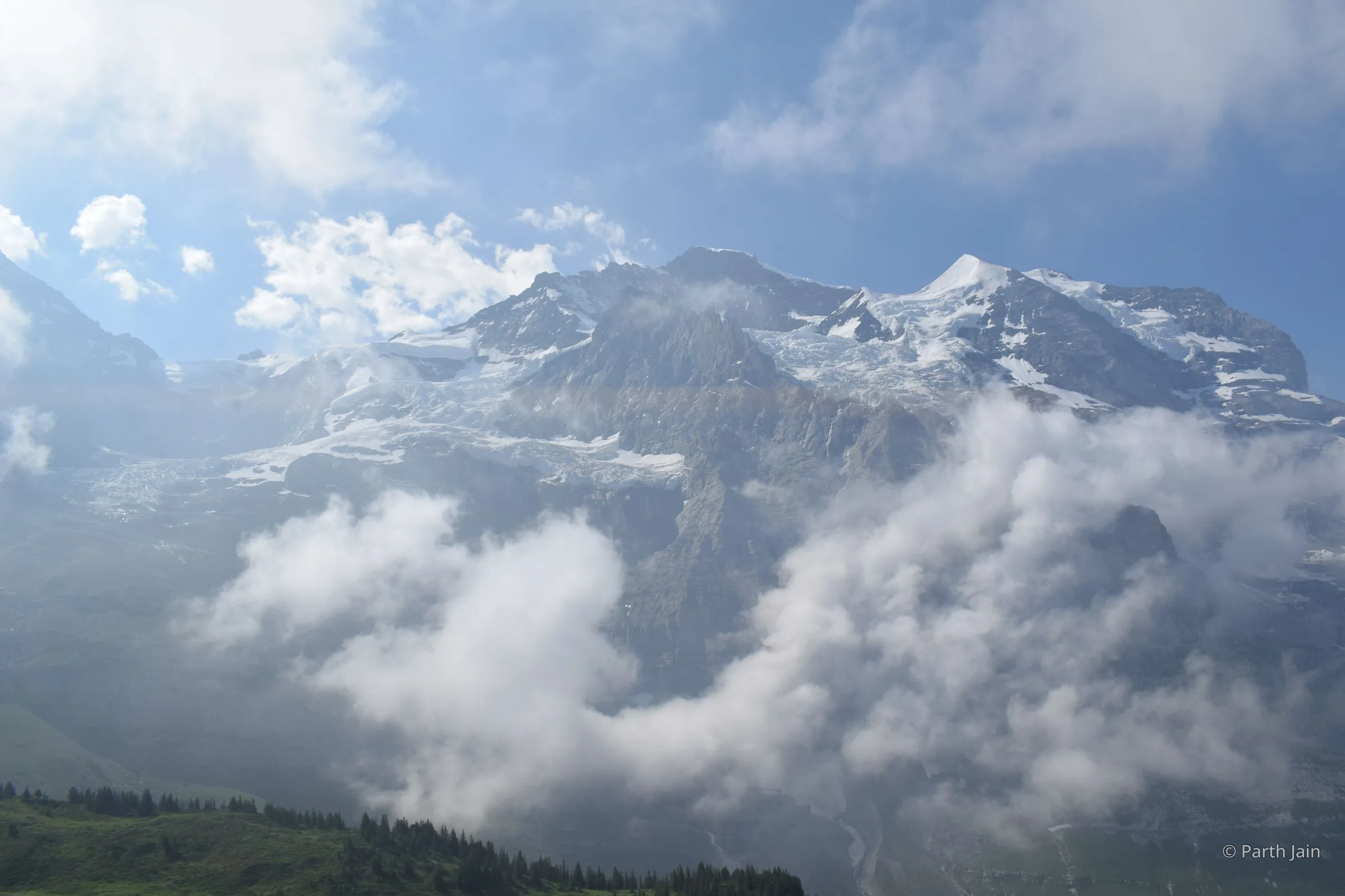 The Jungfrau ridge through a clearing in the cloud, seen from Jungfraujoch.
